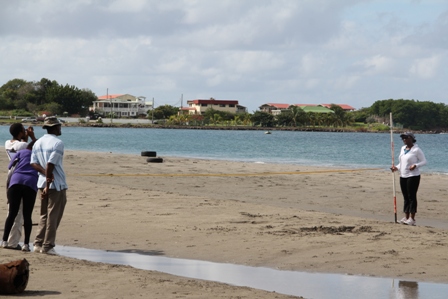 Environmental Officer Claudia Walwyn, Physical Planning Officer in the Department of Planning Thema Ward, Geographic Information System Officer Joel Williams and Environmental Specialist Lemuel Pemberton re-establish markers at Gallows Bay